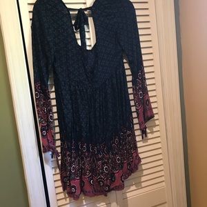 Empire waist dress with flared sleeves.